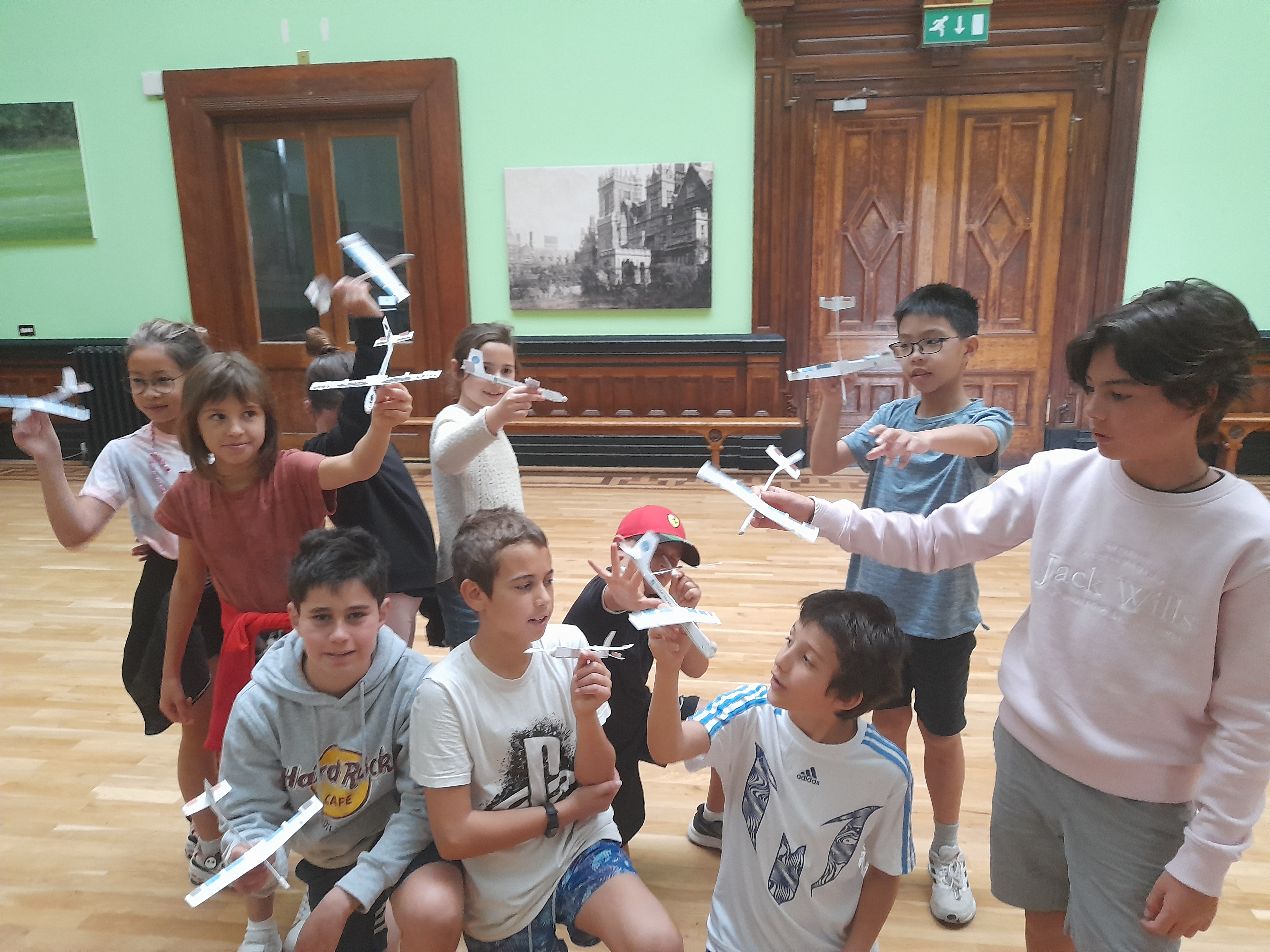 Student Holding Aircraft Gliders