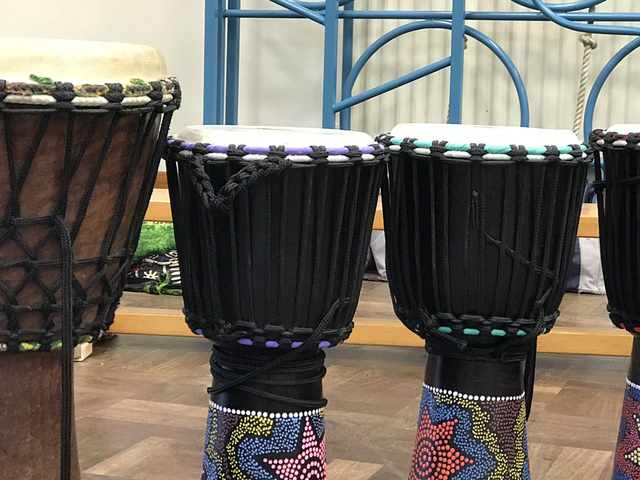 Colourful African drums set up at school