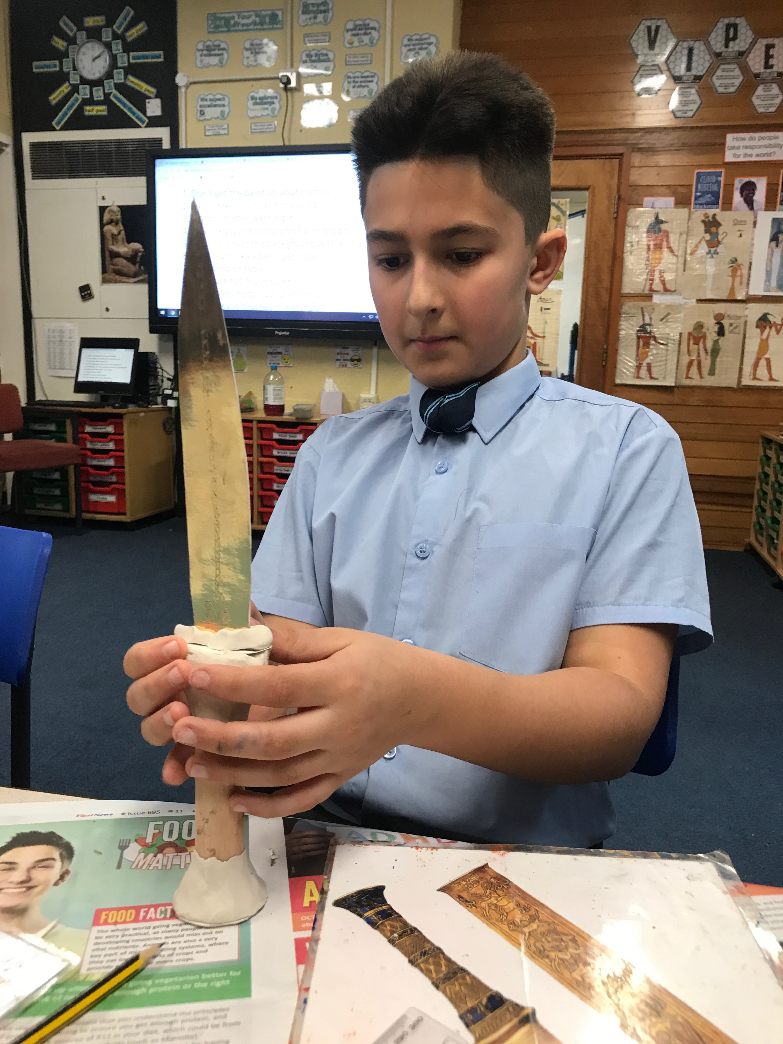 Boy making Tutankhamun's gold dagger