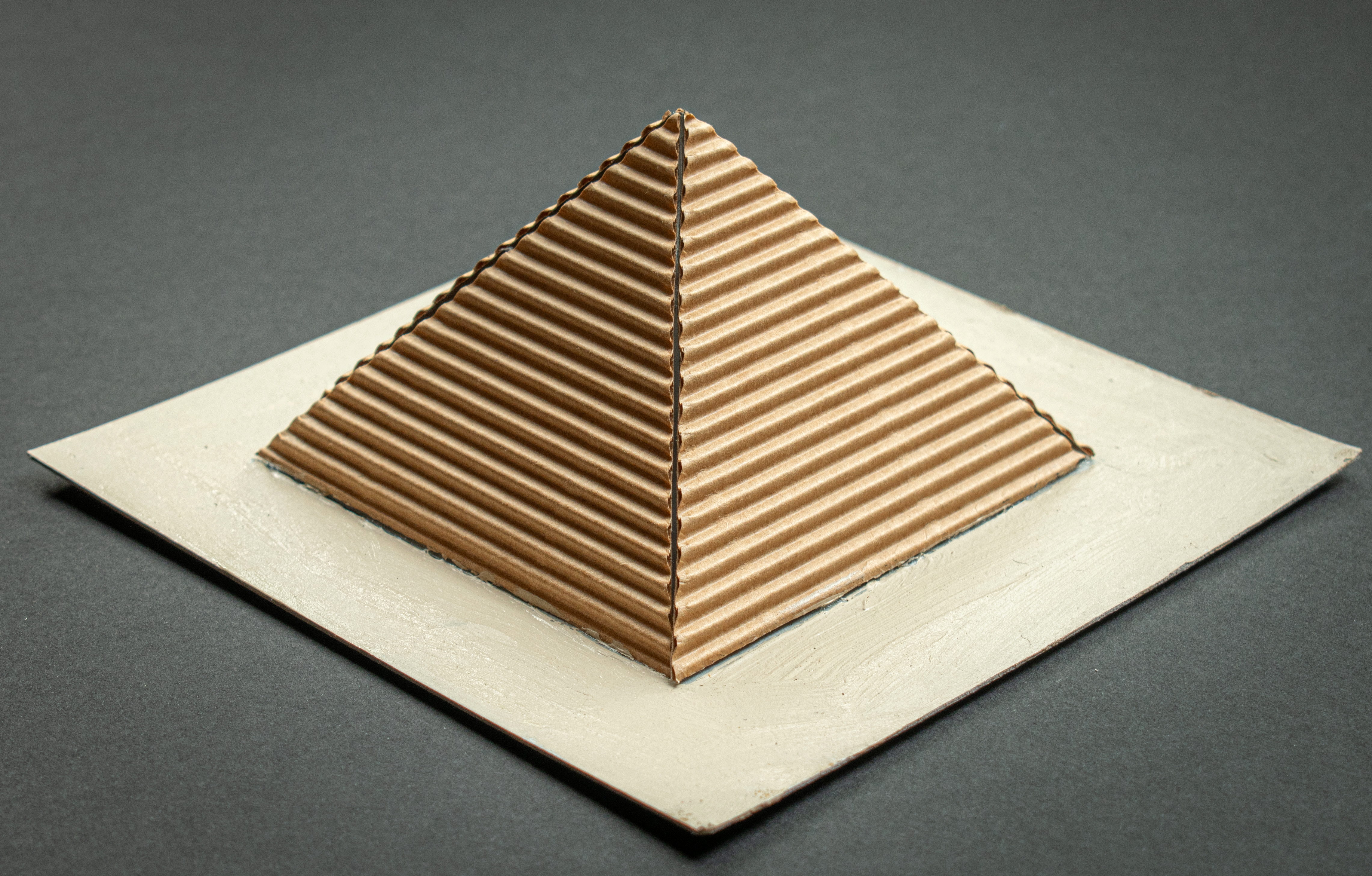 Card model of a pyramid which children make