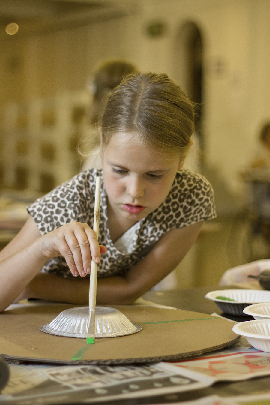 Child making a Viking shield