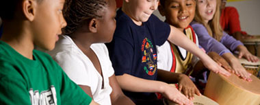 Childre drumming together