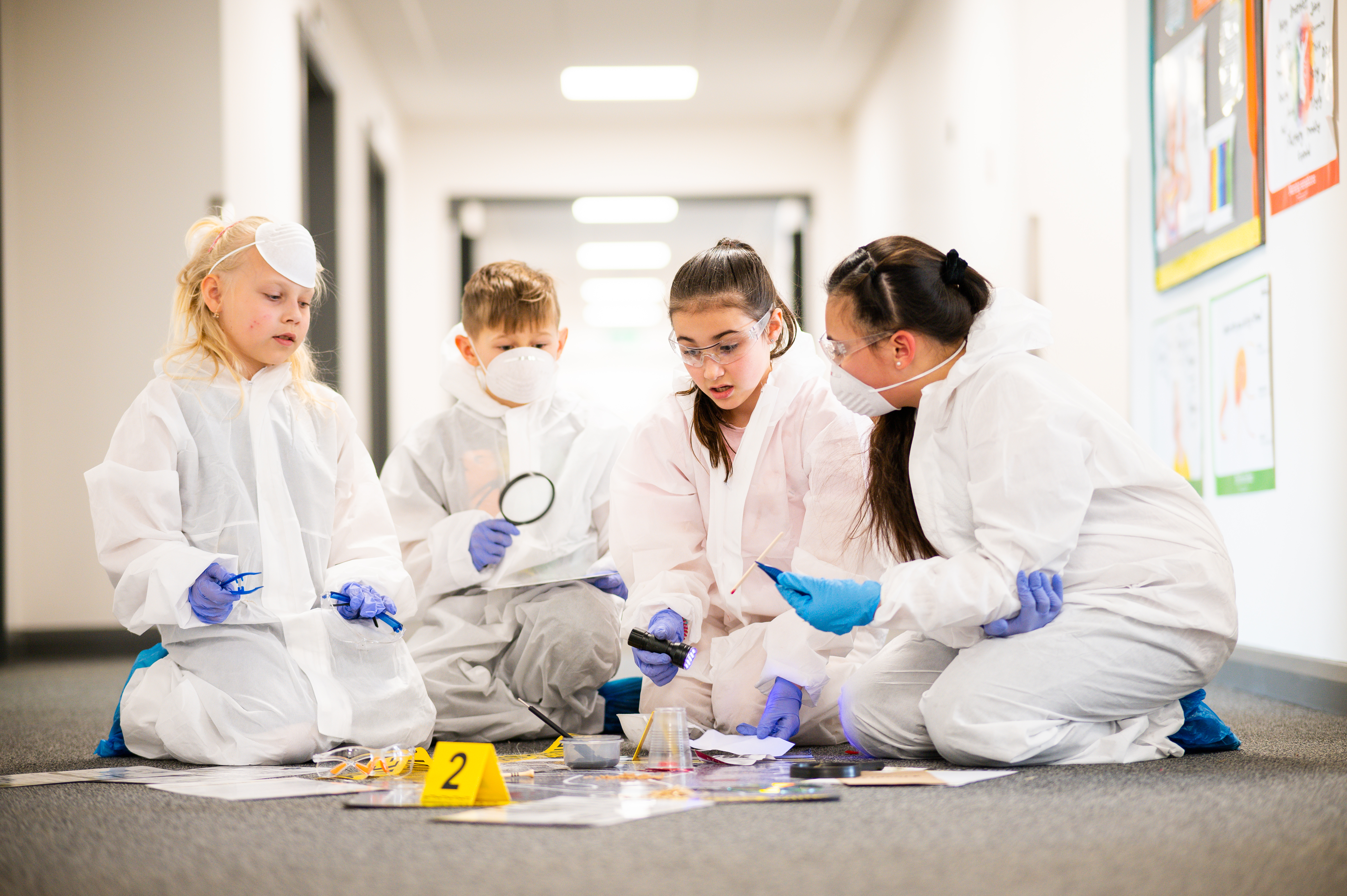 Primary School KS2 Engaged in CSI Workshop Investigation