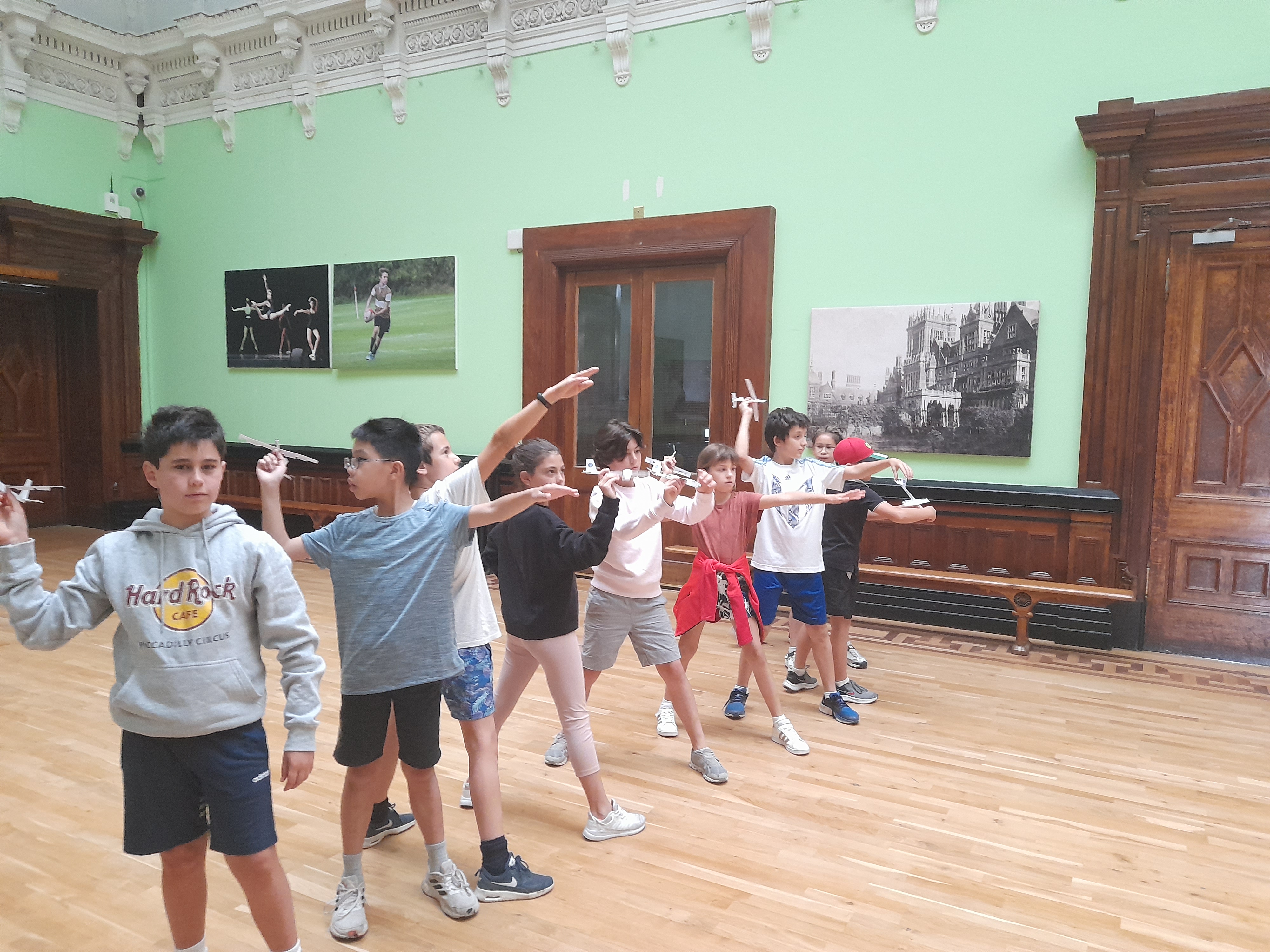 Children Lining Up to Throw Aircraft Gliders