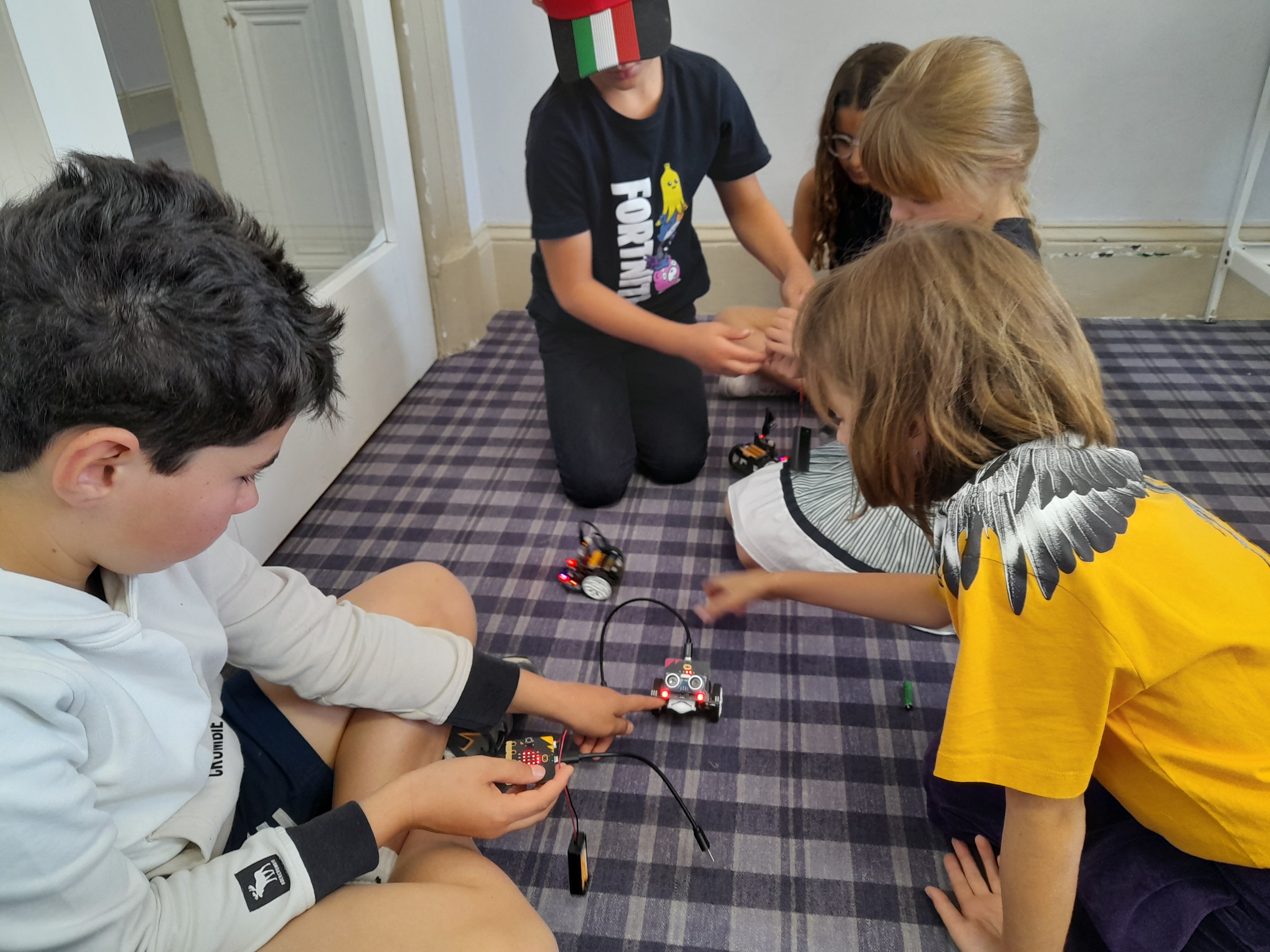 Children Playing with Robots