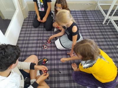 Children playing with robots