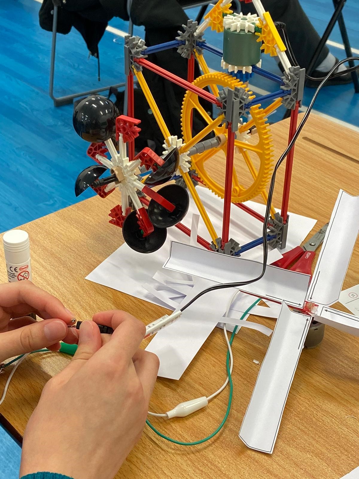 Student Assembling Water Wheel Model