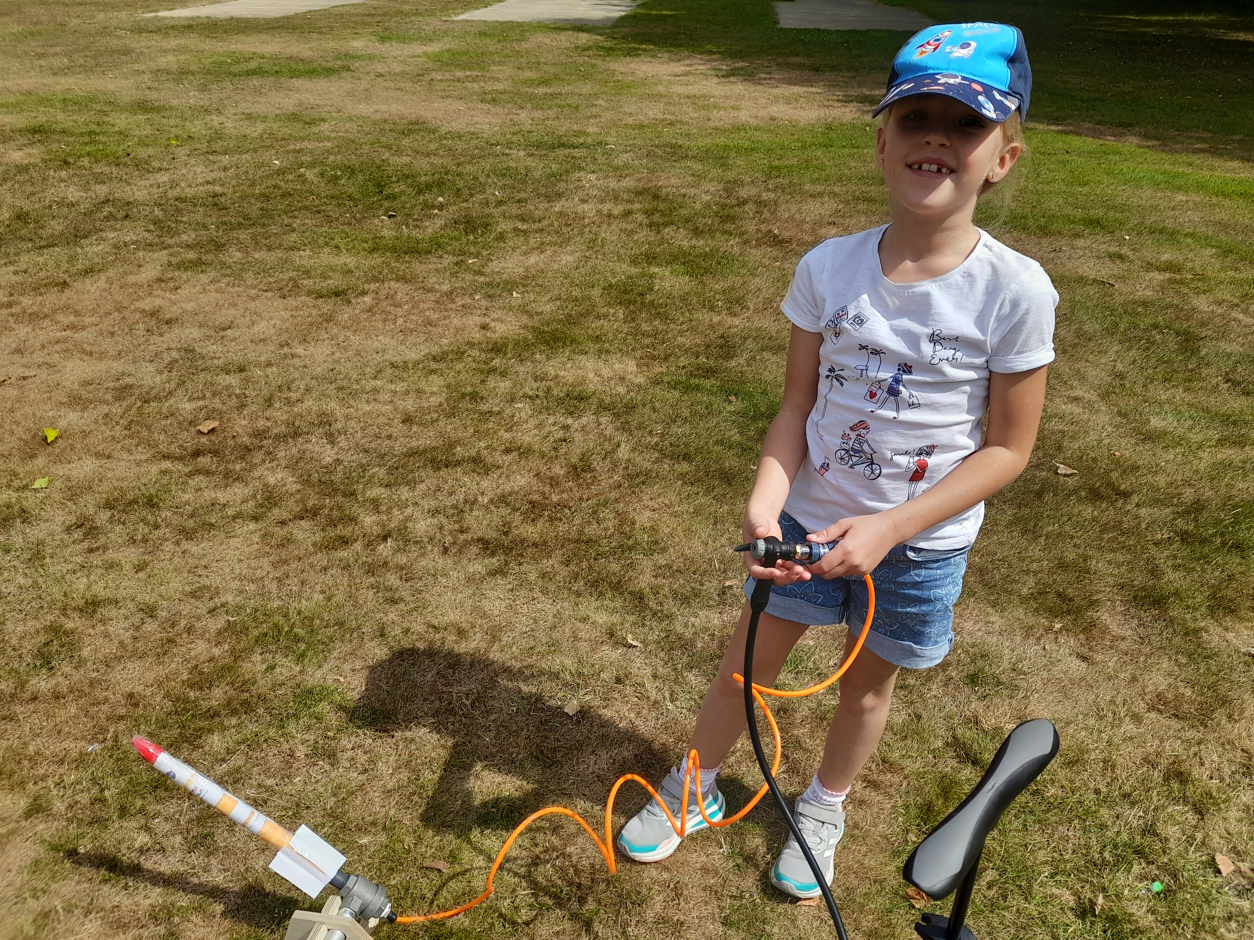 Child Standing with Air Pressure Rocket Kit
