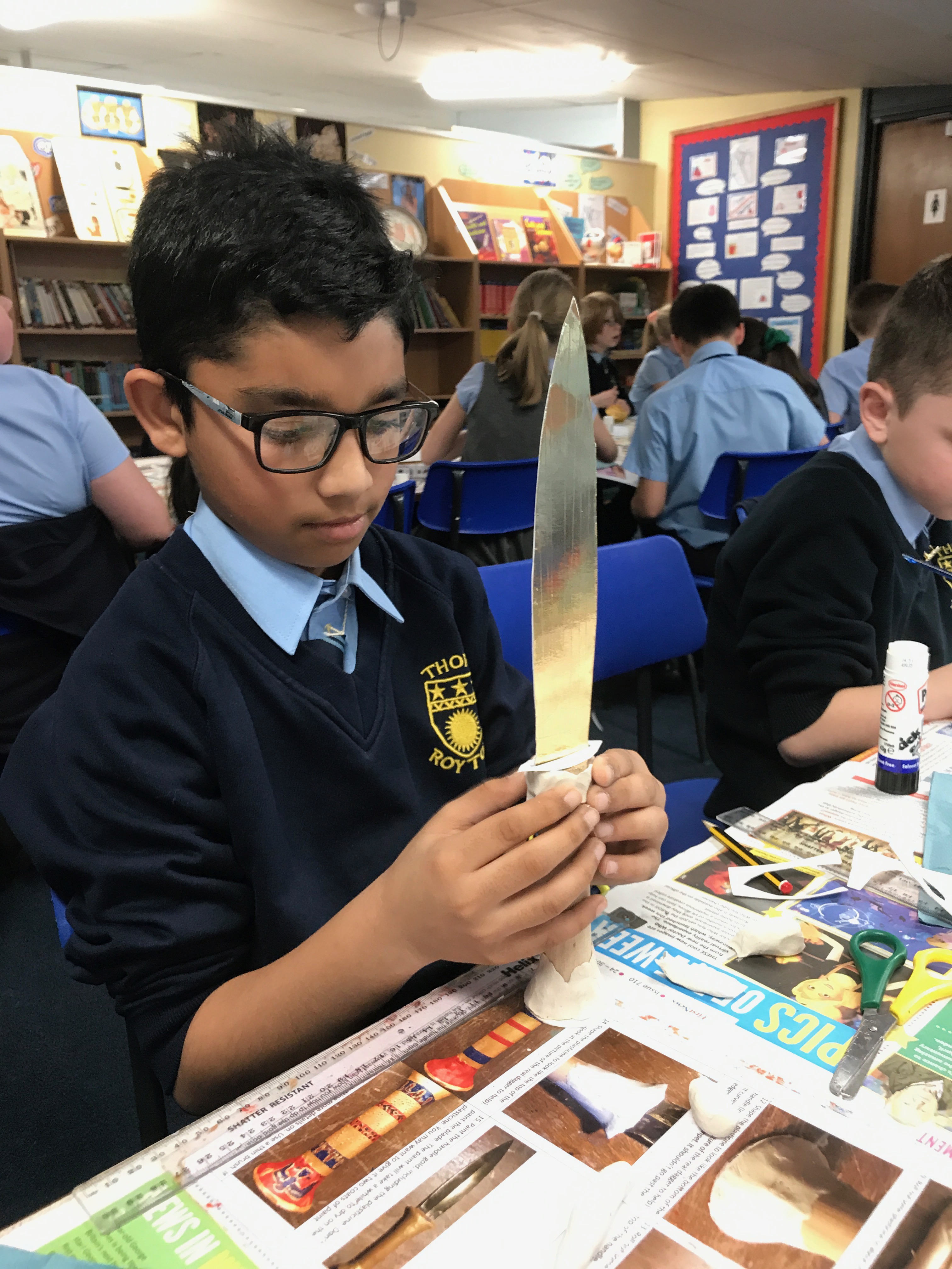 Boy making Tutankhamun's gold dagger