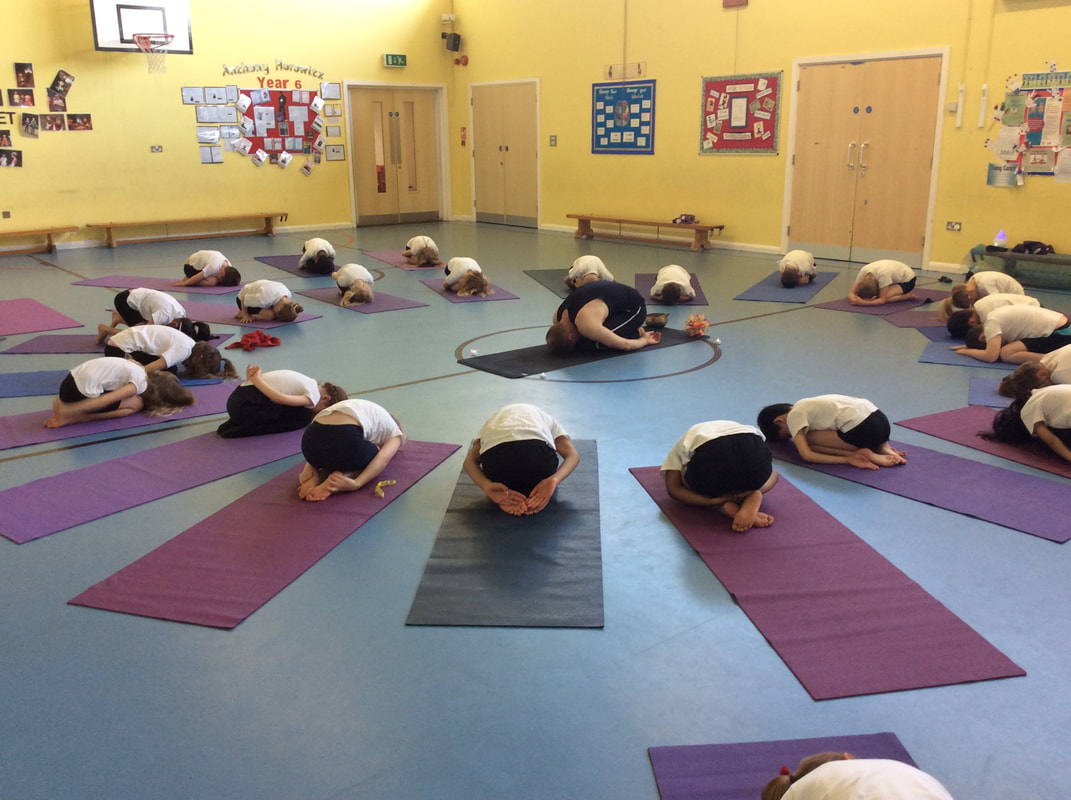 Children in school yoga session