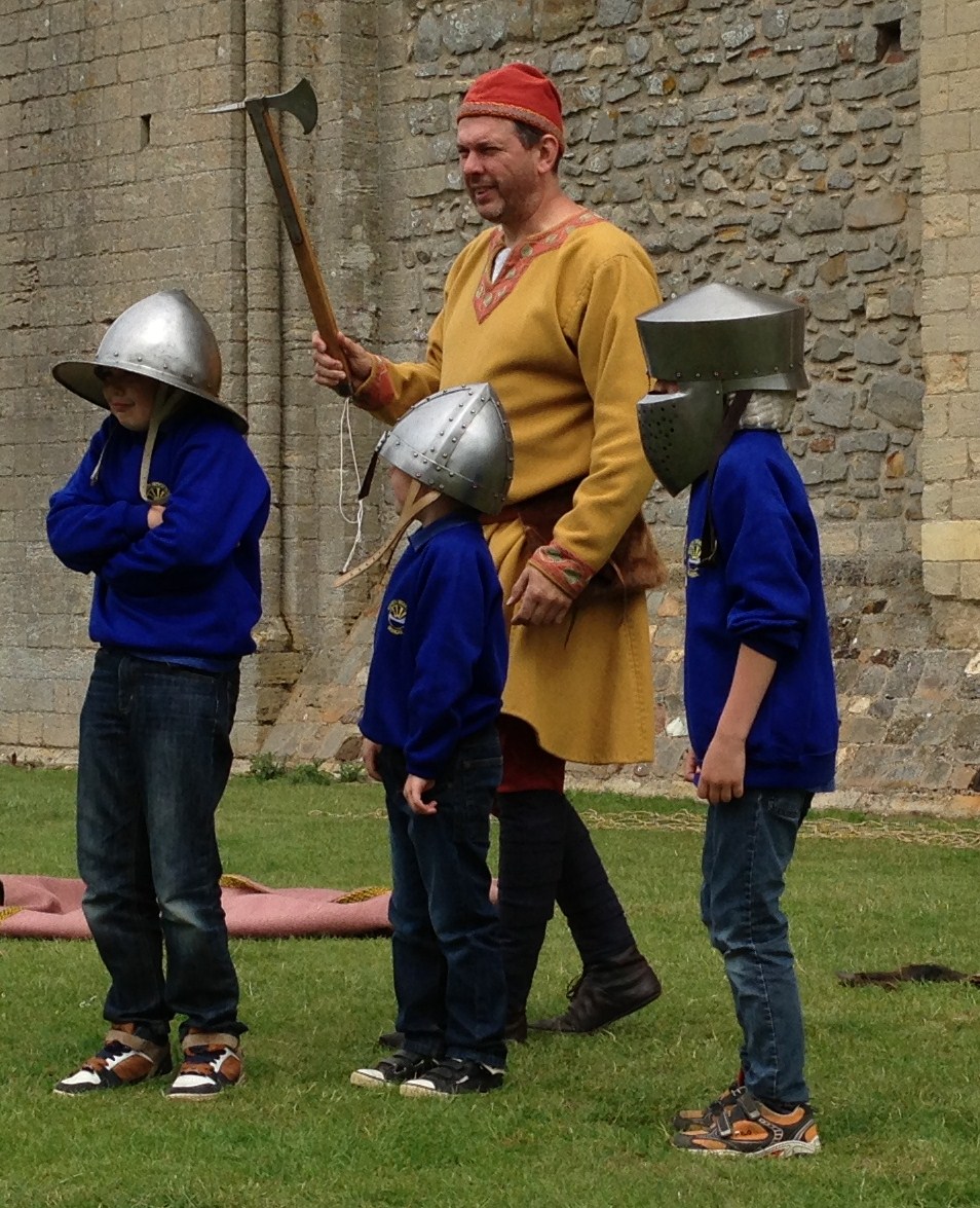 Students wearing real medieval helmets