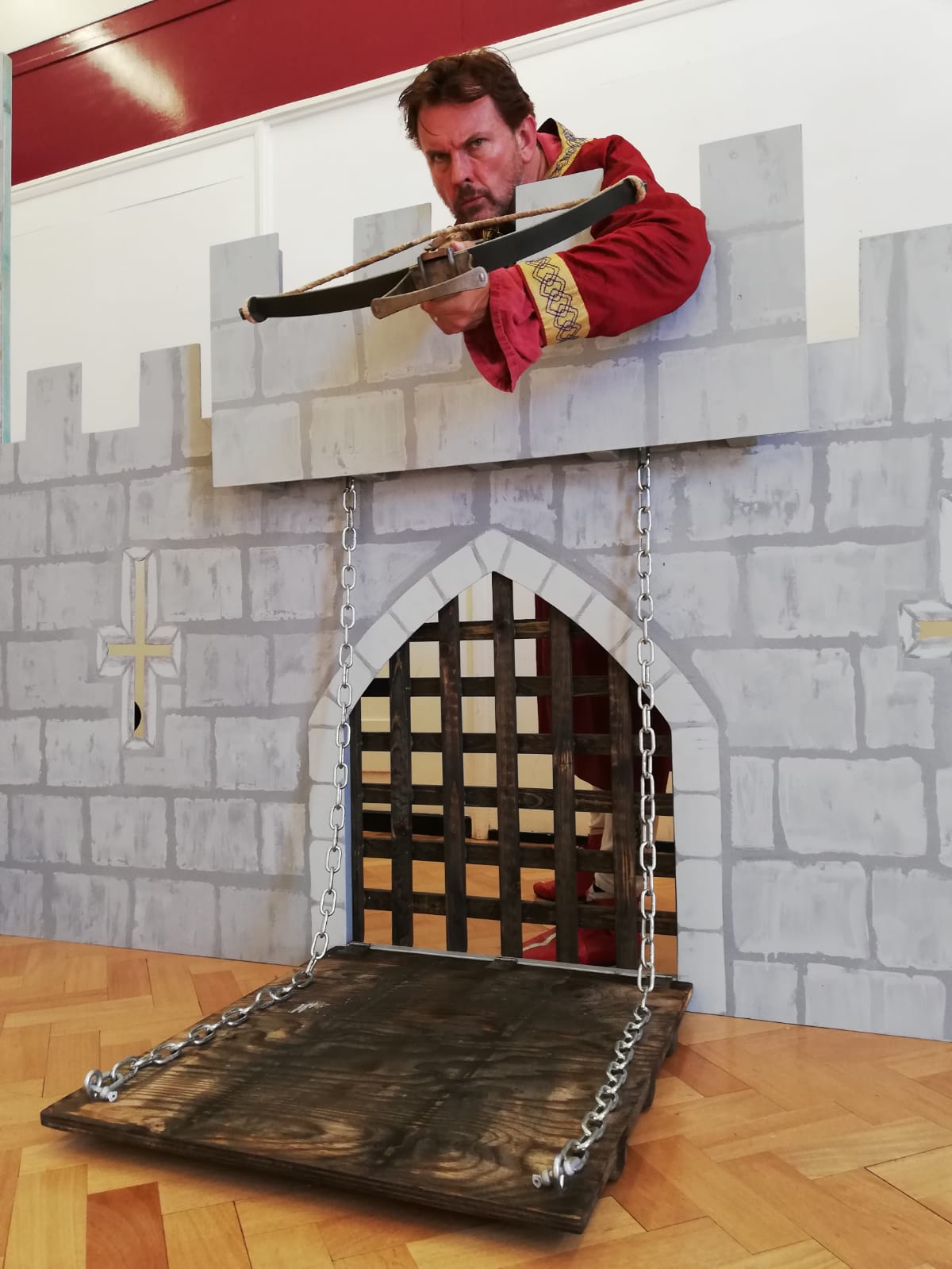 Nobleman defending has castle with a crossbow