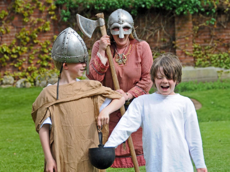 Children taking part in a Trial by Ordeal!  Marvellous History Viking School Workshop