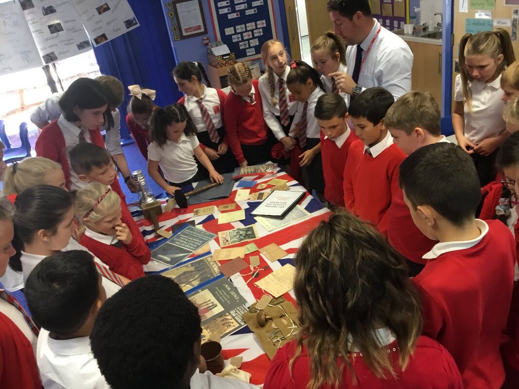 Children exploring WW1 items