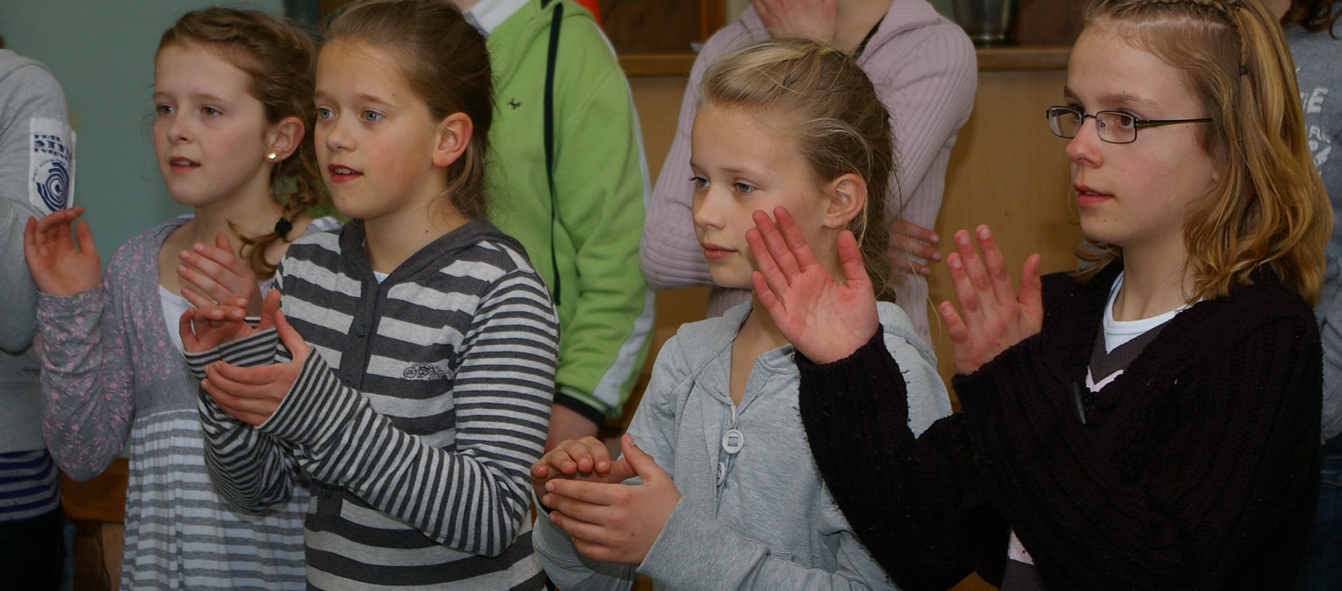 Children making body percussion sounds