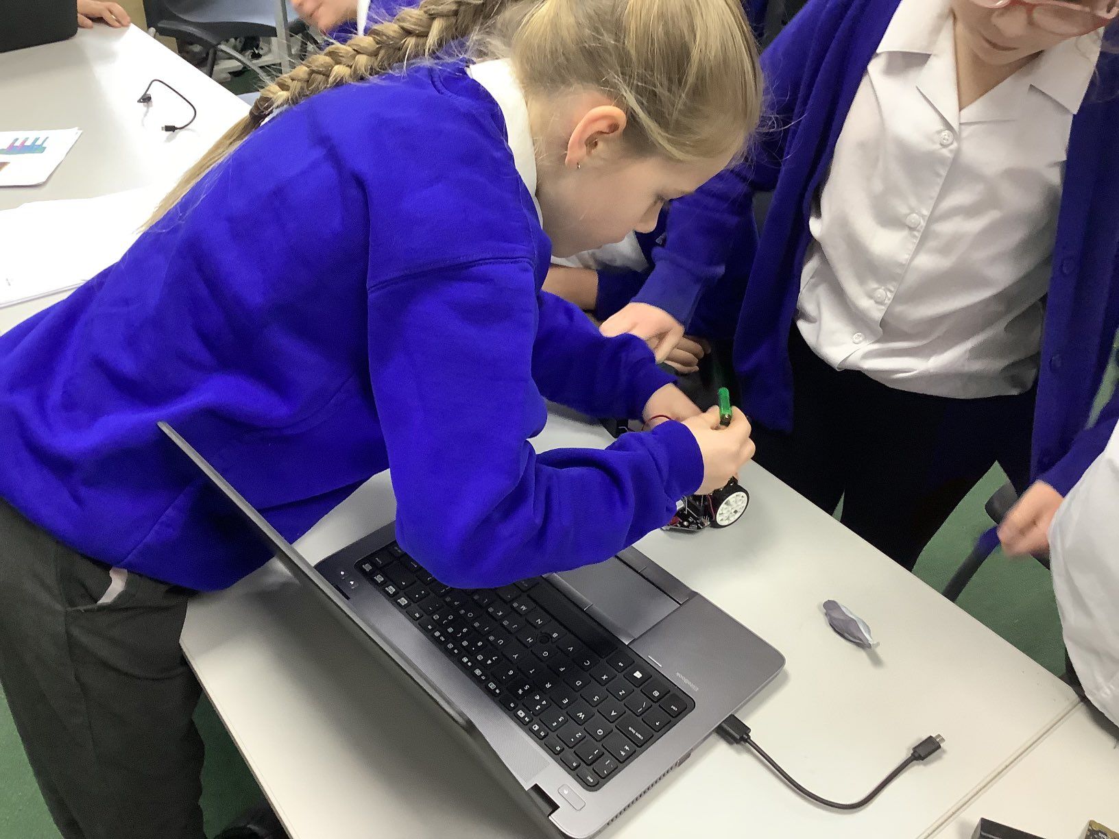 Student Connecting Microbit to Robot