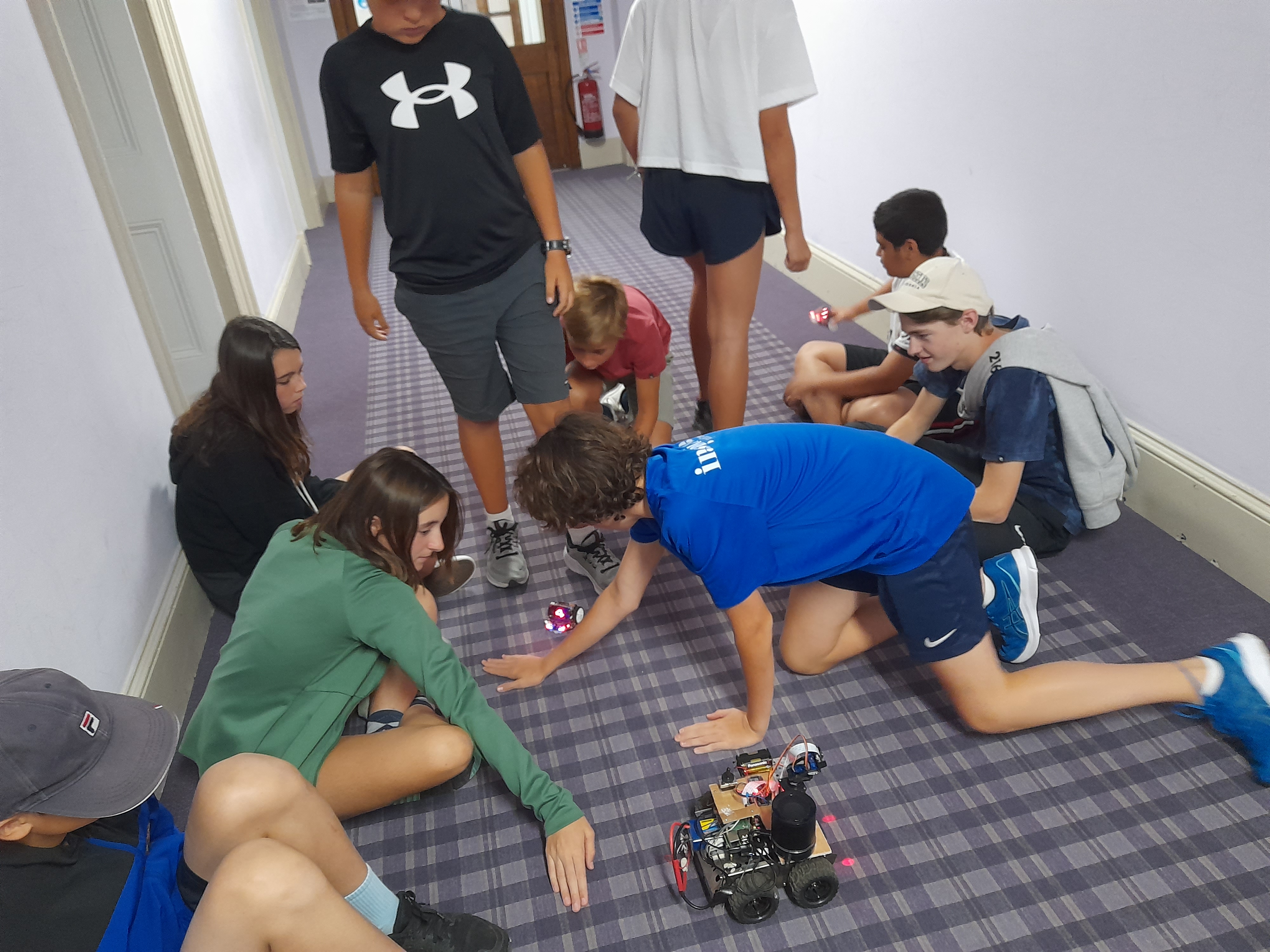 Children Having Fun with Robots on the Floor