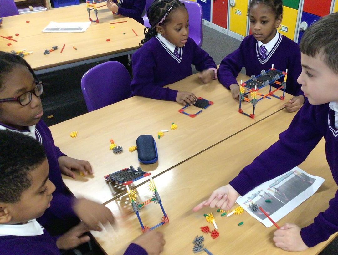 Children working together to build a bridge